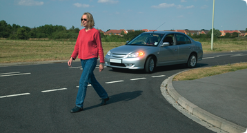 Give way to pedestrians who have started to cross